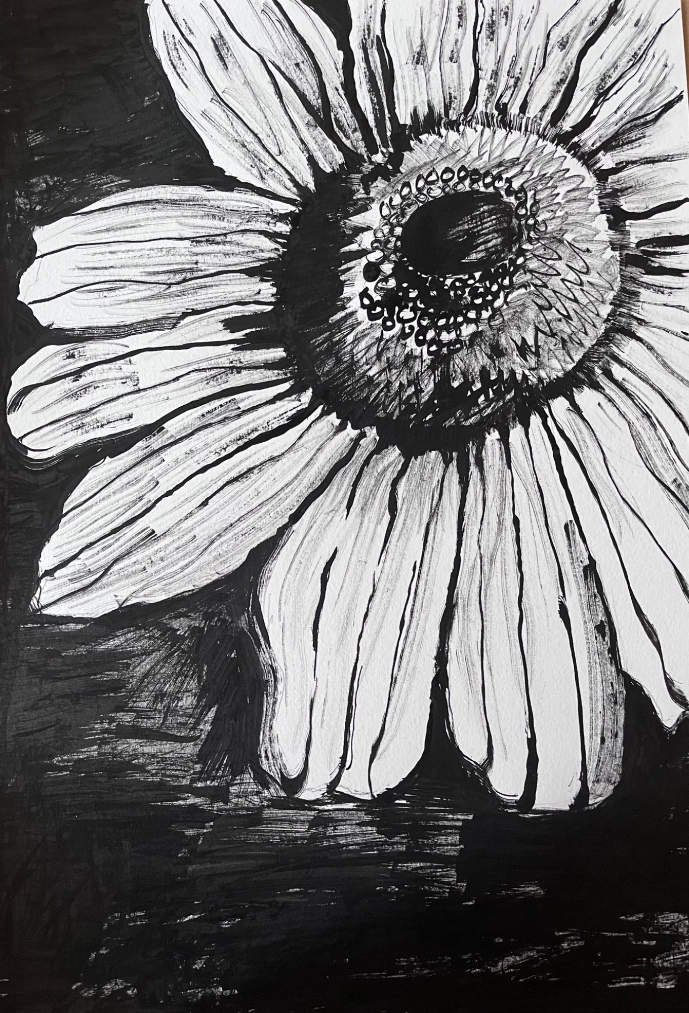 Inky flower Black and white illustration of a sunflower, highlighting its petals and center.